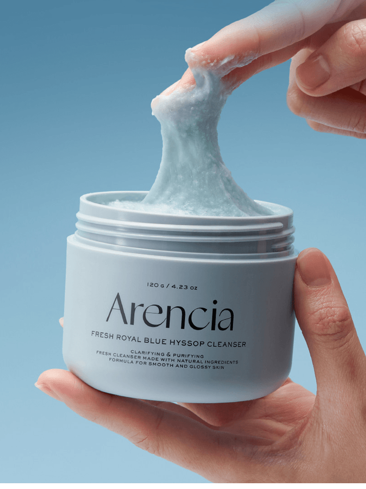 ARENCIA Blue Hyssop Cleanser texture being pulled from container, designed for oily skin.