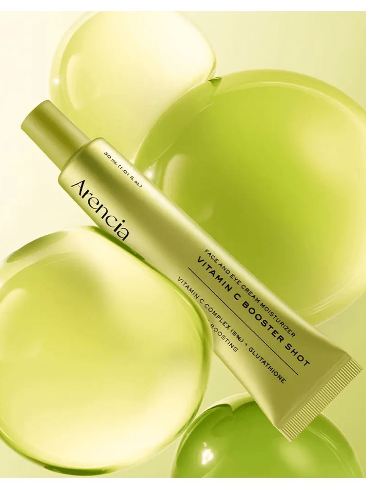 ARENCIA Vitamin Booster Shot tube with green background, highlighting vitamin C benefits and radiant skin.