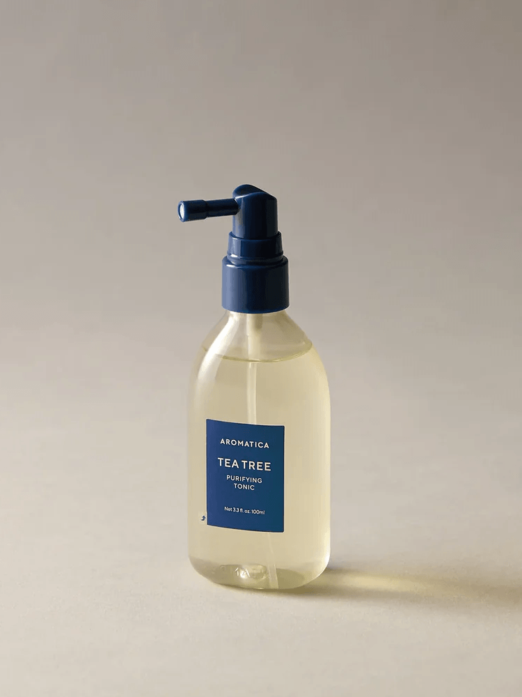 AROMATICA Tea Tree Purifying Tonic 100ml in a clear bottle with pump, designed for oily scalp refreshment.