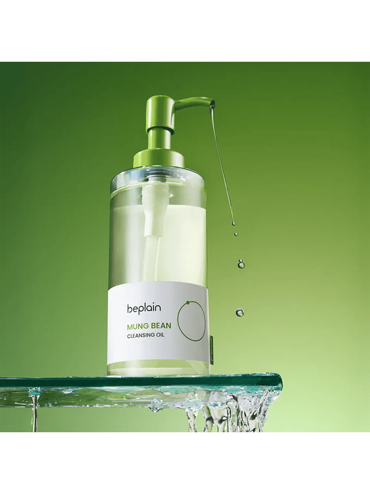 BEPLAIN Mung Bean Cleansing Oil 200ml in a bottle with a green pump, splashing water in a vibrant green background.