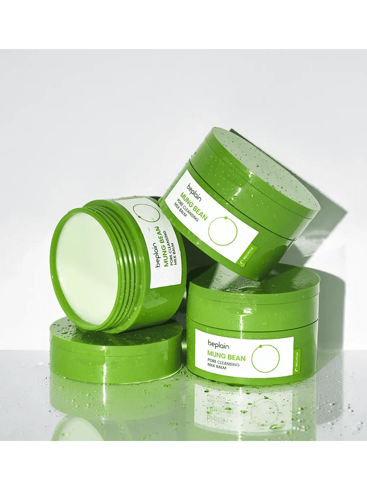 BEPLAIN Mung Bean Pore Cleansing Milk Balm jars stacked on a wet surface.