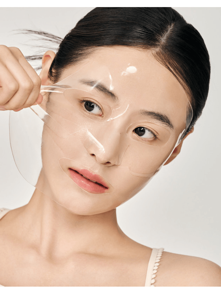Person applying BIODANCE Bio Collagen Real Deep Mask, showcasing its gel sheet texture and hydration benefits.