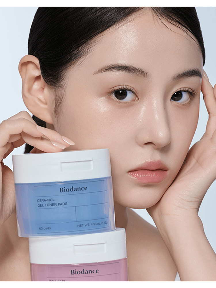 Woman holding BIODANCE Cera-nol Gel Toner Pads container for skincare demonstration.