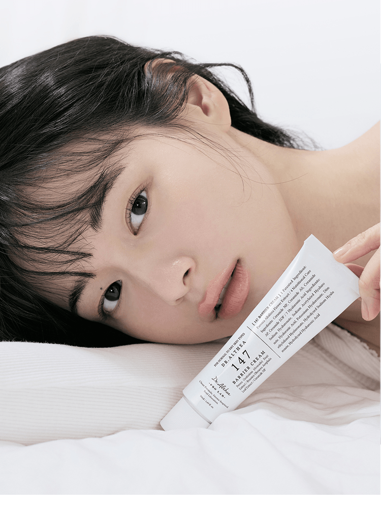 Model showcasing Dr.Althea 147 Barrier Cream 50ml on a white background, emphasizing hydration and skin barrier support.
