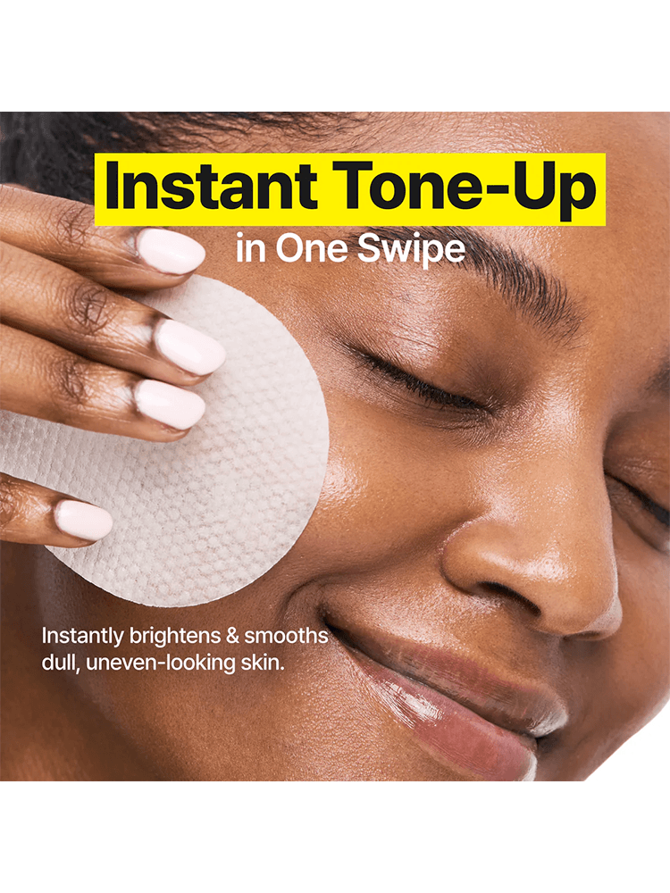 A woman using GOODAL Green Tangerine Vita C Dark Spot Care Pad for instant tone-up and brightening.