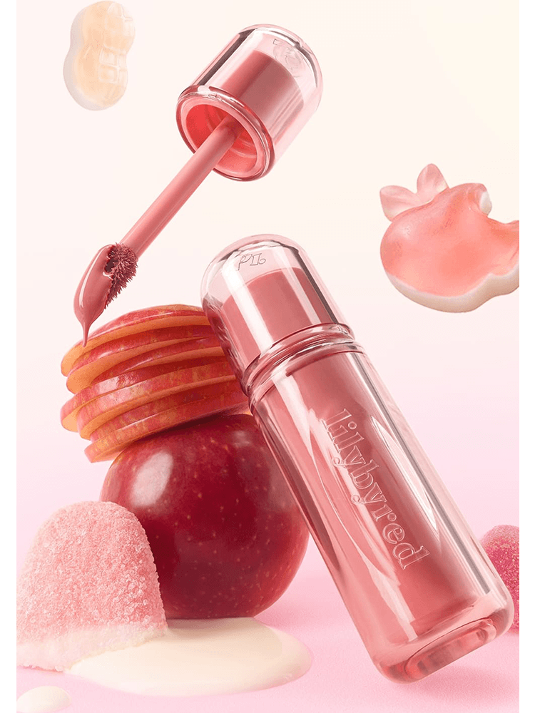 LILYBYRED Bloody Liar Coating Tint 26D in a glossy bottle with apple slices and candy, showcasing juicy lip color.