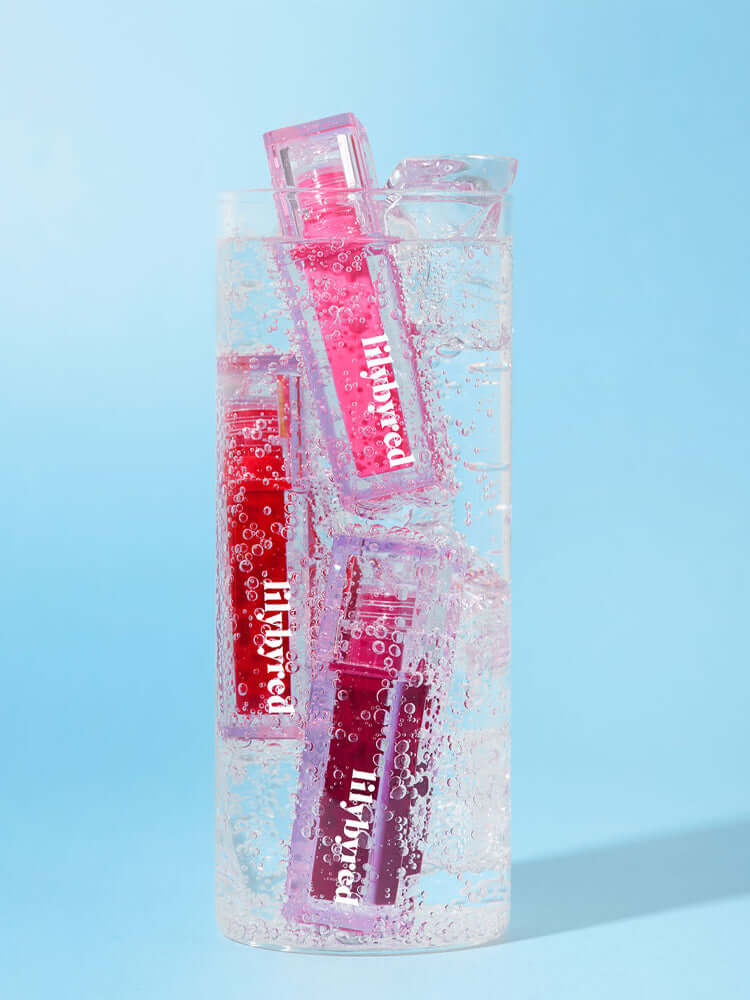 LILYBYRED Juicy Liar Water Tint 4.8g vibrant colors in water, showcasing freshness and playful design.