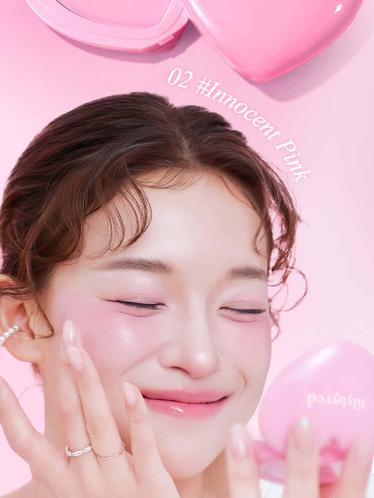 LILYBYRED Luv Beam Cheek Balm on a model's cheeks in a soft pink shade, showcasing a natural dewy glow.