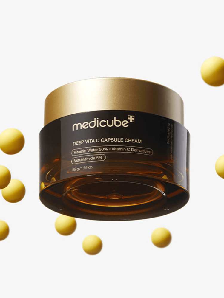 MEDICUBE Deep Vita C Capsule Cream jar with yellow vitamin capsules, 55g, designed for brightening and skin tone improvement.