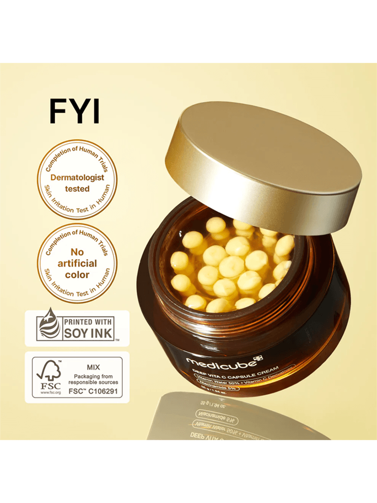 MEDICUBE Deep Vita C Capsule Cream 55g jar with vitamin capsules and dermatologist-tested labels on a golden background.