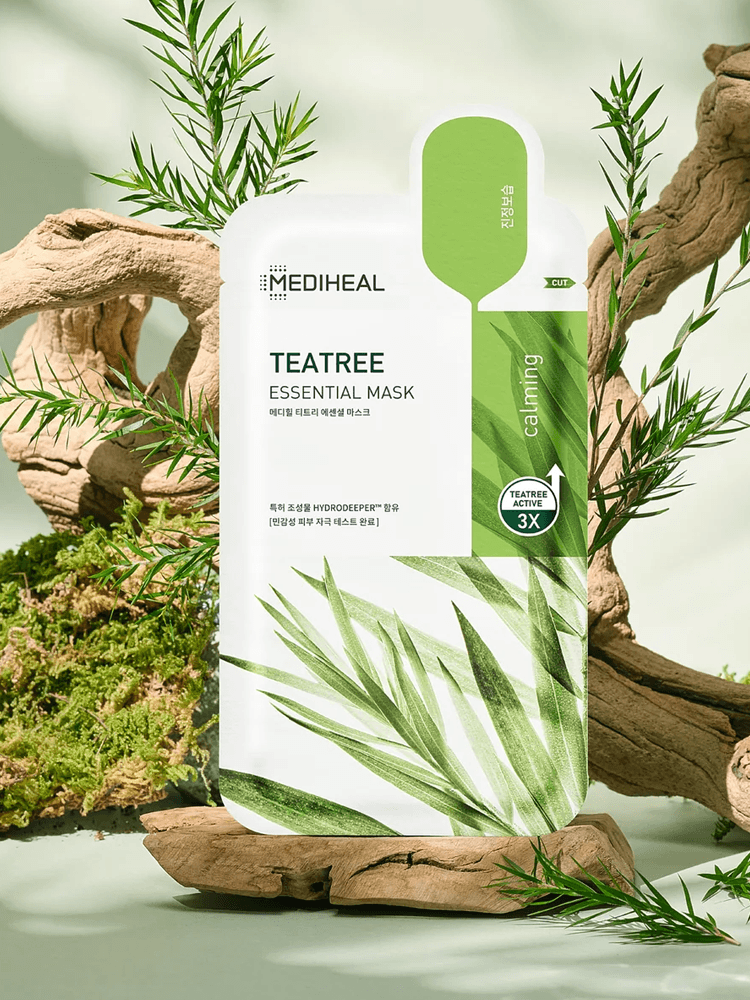 MEDIHEAL Teatree Essential Mask Calming Barrie packaging displayed with natural elements in a soothing setting.