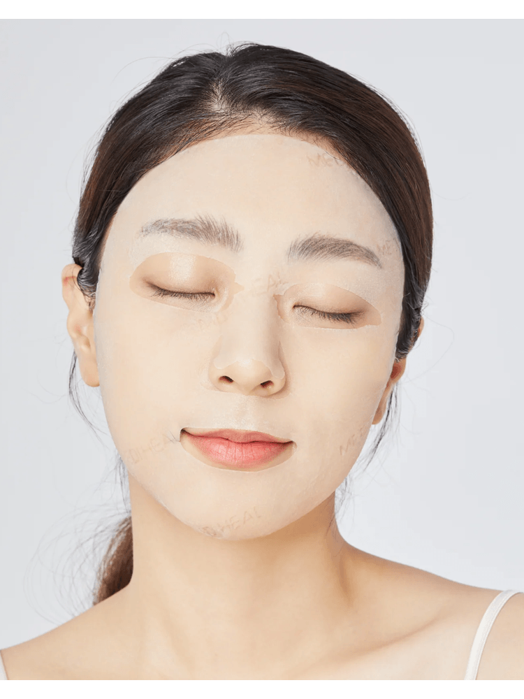 Woman using MEDIHEAL THE N.M.F Ampoule Mask for hydration and a dewy finish on her skin.