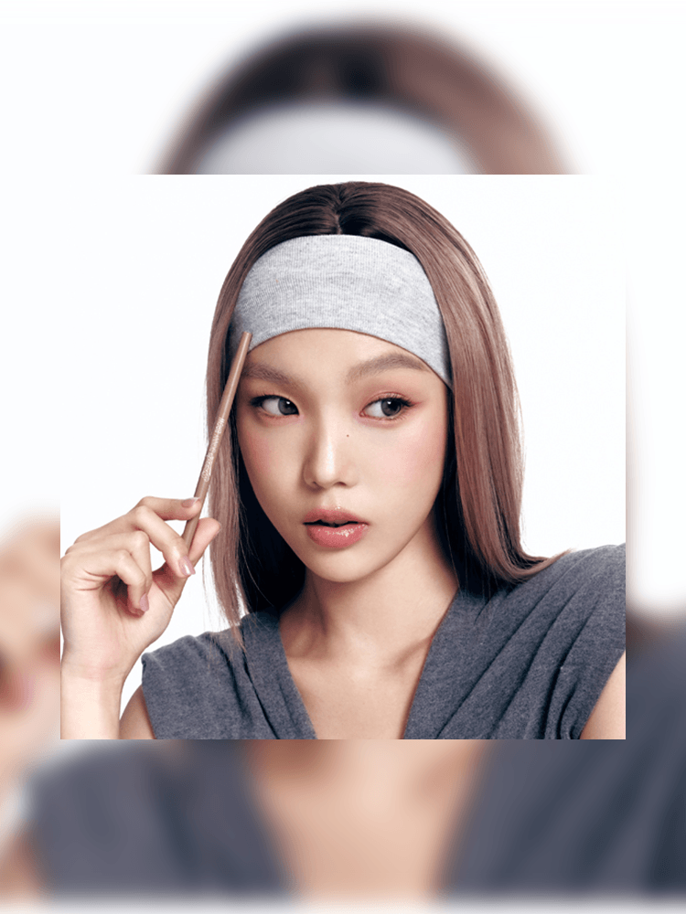 Model applying makeup with PERIPERA Speedy Skinny Brow 0.05g for perfectly defined eyebrows.