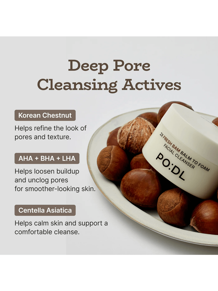PODL 2X Fresh Bam Balm To Foam with ingredients for deep pore cleansing on a plate of chestnuts.