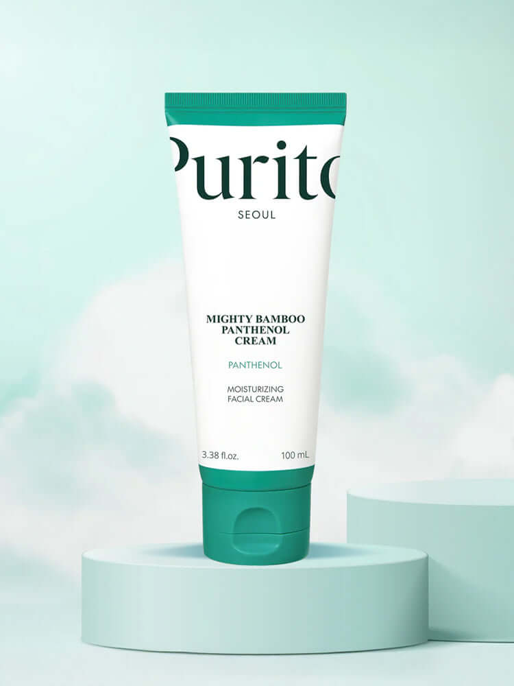 PURITO Mighty Bamboo Panthenol Cream 100ml in a green and white tube against a soft blue background.