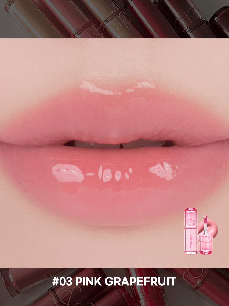 Close-up of lips wearing rom&nd The juicy lasting tint Mini #03 Pink Grapefruit, showcasing a glossy and vibrant finish.