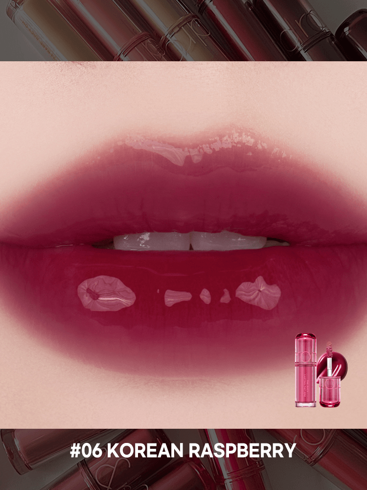 Close-up of lips with rom&nd The juicy lasting tint in shade #06 Korean Raspberry, showcasing a glossy, rich finish.