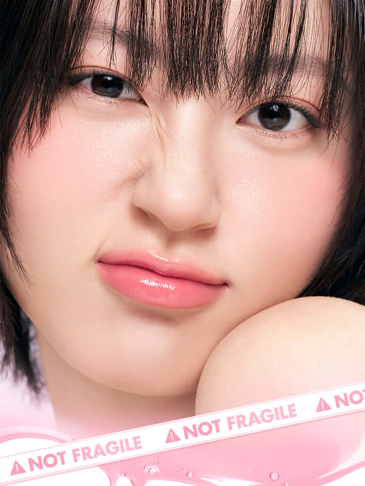 Close-up of a woman with glossy lips showcasing the new Romand Juicy Lasting Tint, perfect for Korean Cosmetics New Zealand.