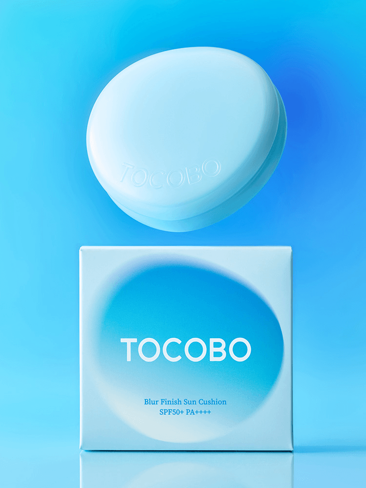TOCOBO Blur Finish Sun Cushion 13g SPF50+/PA++++ in blue packaging against a gradient blue background.