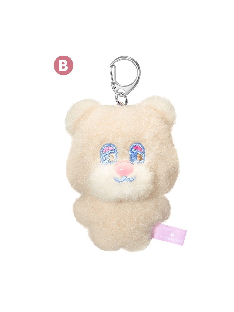 rom&nd Neonmoon doll plush bear keychain with colorful eyes and pink nose.