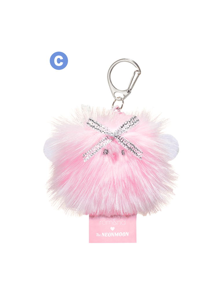 Rom&nd Neonmoon doll keychain, fluffy pink accessorized with a decorative bow.