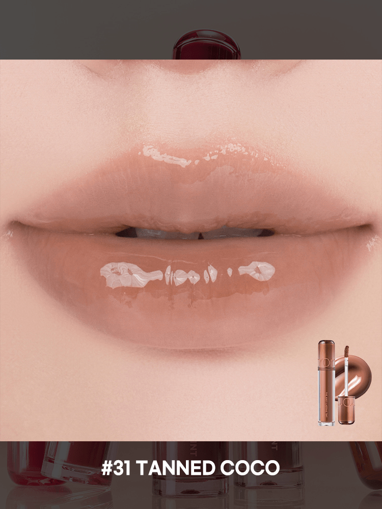 romnd The Juicy Lasting Tint NEW WARM lip gloss in shade #31 Tanned Coco applied on lips.