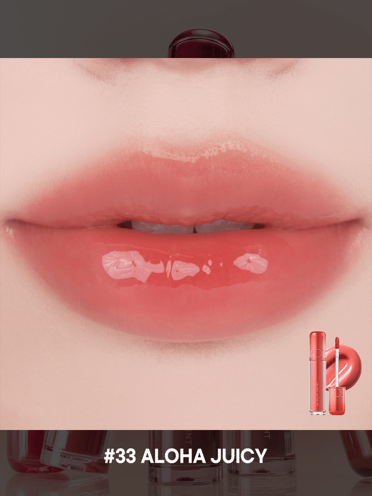 romnd The Juicy Lasting Tint NEW WARM swatch on lips showcasing glossy finish and the shade #33 Aloha Juicy.